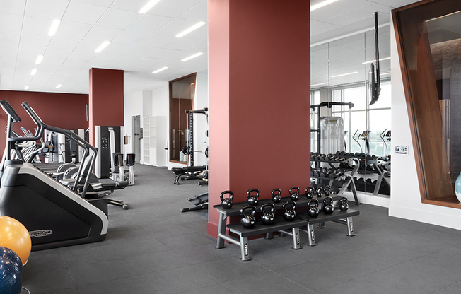 Fitness center with Technogym® cardio and weight equipment and three flex studios, featuring kickboxing, Peloton® cycle bikes and Fitness On Demand™