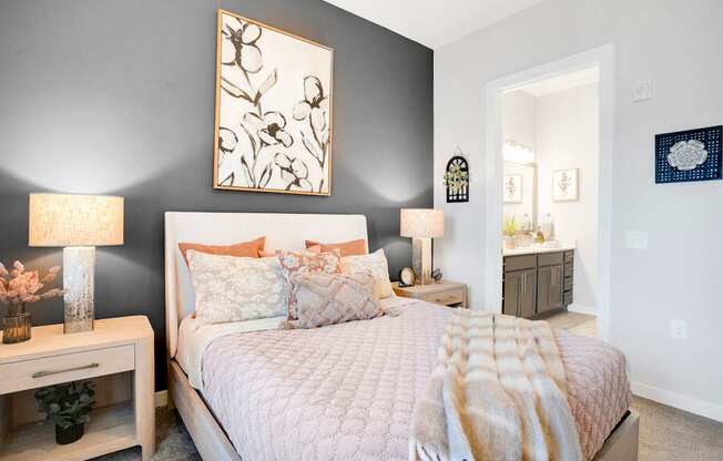 A Bedroom With a Window and Curtains at The Aster Apartments, Cary, NC, 27519