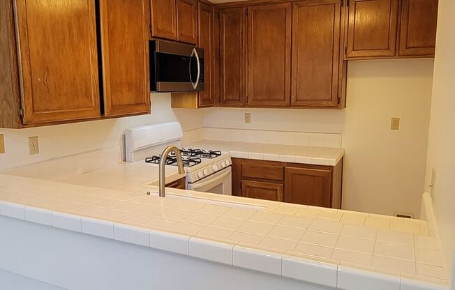 Top Floor Penthouse Loft Condo | Fireplace | Laminate Flooring | Community Swimming Pool