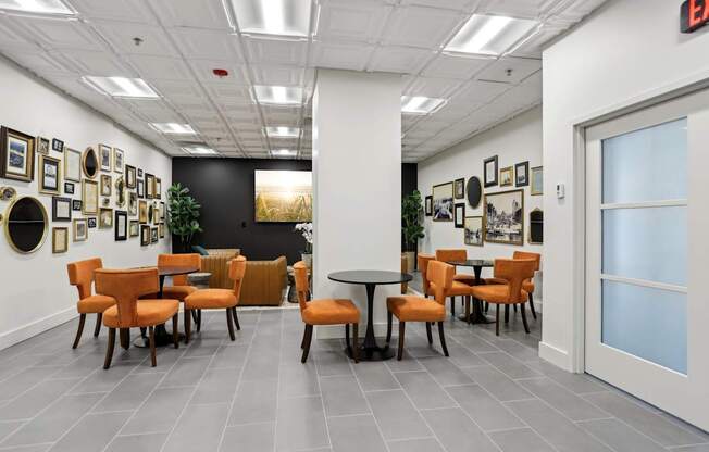 A room with a white ceiling and a black wall with a white door.