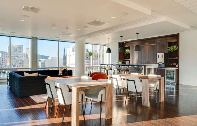 A modern dining room with a table set for four.