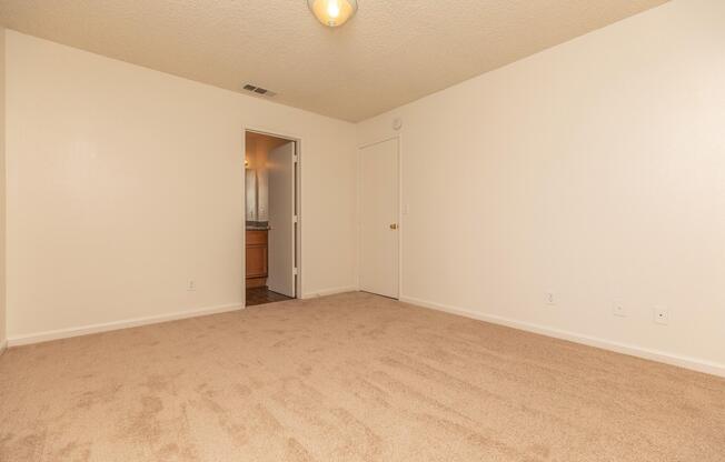 a bedroom with a bed in a room