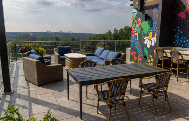 a patio with a table and chairs on a balcony