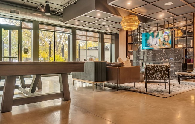 A room with a wooden table and a chair with a patterned cushion.