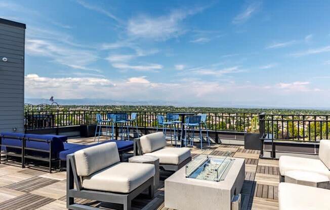 a large deck with furniture and a view of the city