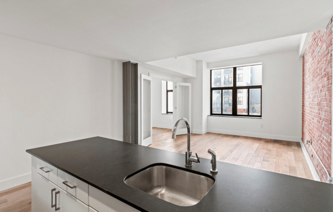 Explore this trendy apartment space featuring modern design and abundant natural light.