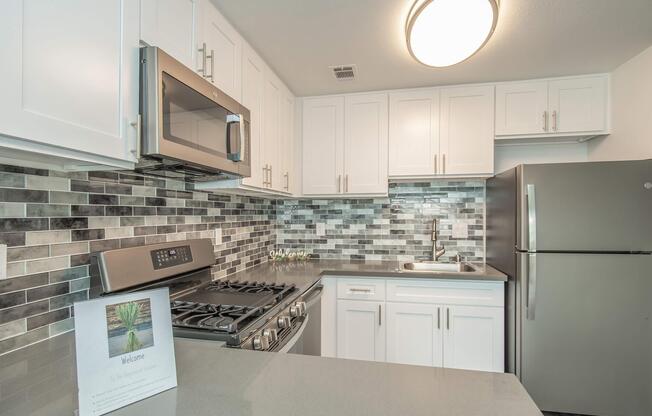 a kitchen with a stove top oven sitting inside of a refrigerator
