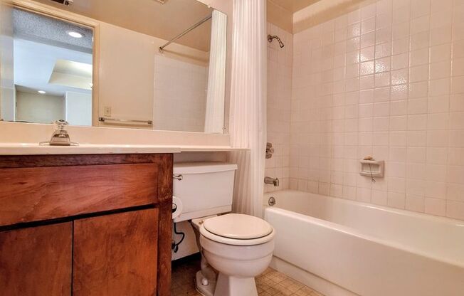 Spacious First Floor 2bd Condo With Laundry In Unit, Pool, Patio, & Carport!