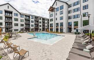 Incredible inground saltwater pool with abundant seating at Novel Cary