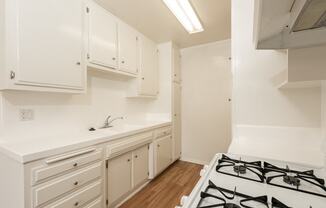 Kitchen with White Appliances and White Cabinets