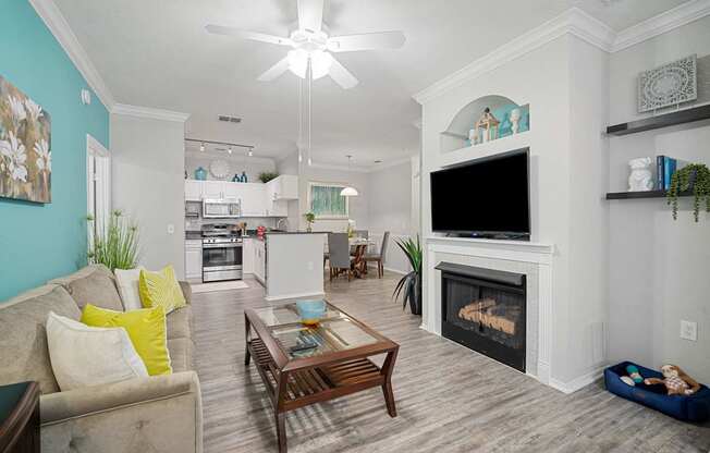 living room with sofa, coffee table and fireplace