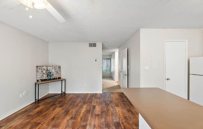 a kitchen area with wooden wheels in a room