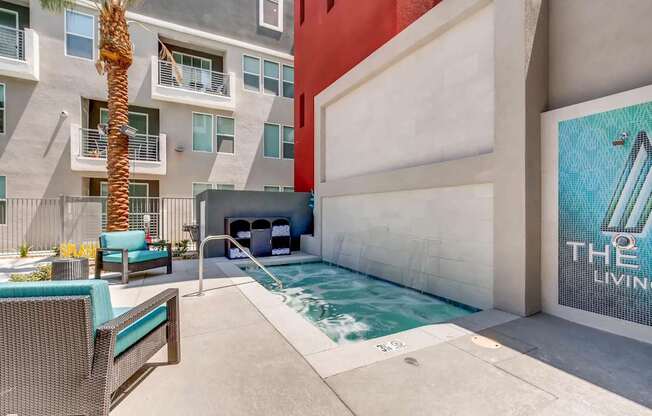 A pool area with a sign that says "The Living".