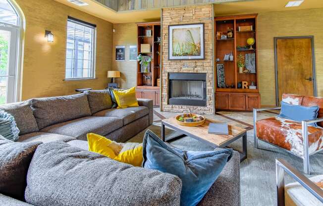 a living room with a fireplace and couches  at Riverset Apartments, Memphis