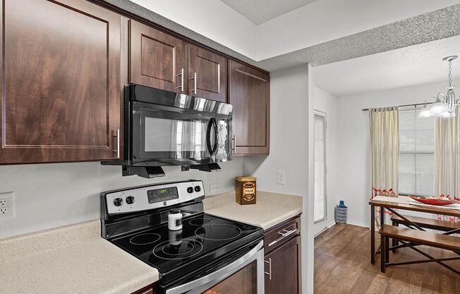 a kitchen with a stove and a microwave