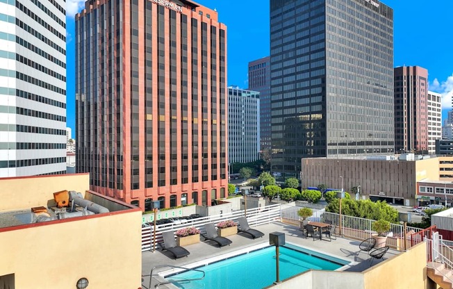 View of buildings and a pool in the foreground.