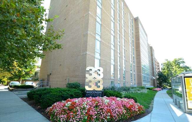 a large brick building with a sign in front of it