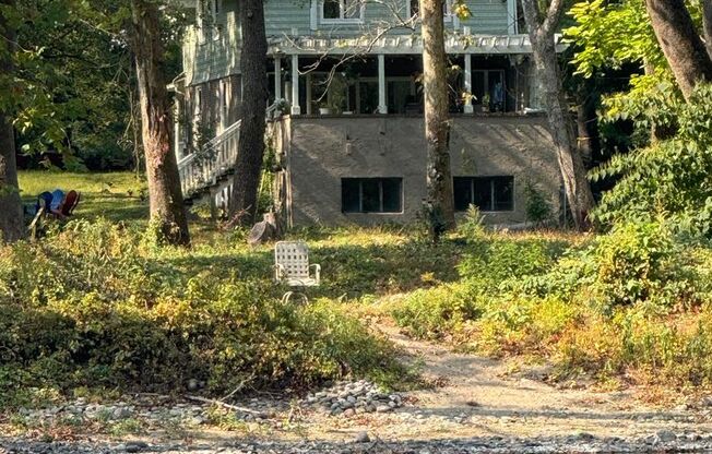 Riverfront home in a quiet spot, 3 acres, deck, parking, laundry, storage, fireplace