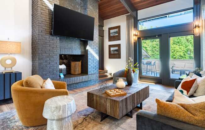 a living room with a fireplace and a television