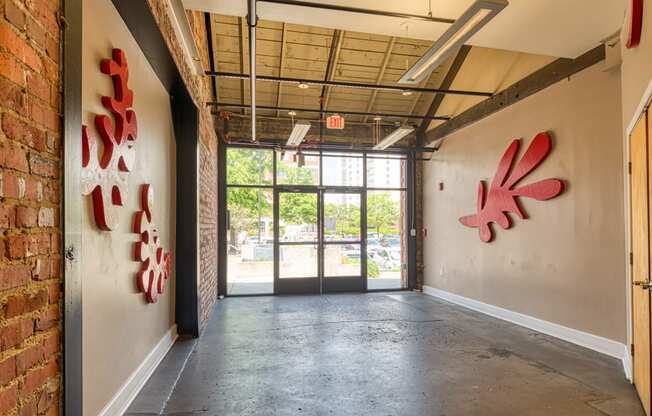 an empty room with graffiti on the wall and a doorway