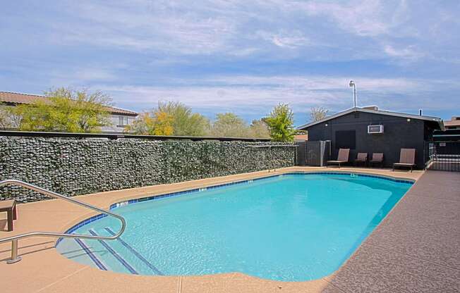 a resort style swimming pool at the enclave at woodbridge apartments in sugar land, tx