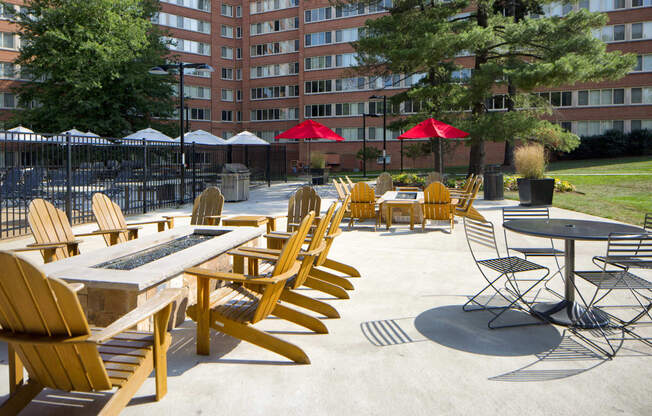 an outdoor patio area with tables and chairs and umbrellas