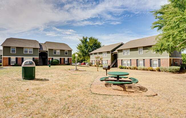 courtyard space with green grass and building exteriors  at Arbors Of Cleburne, Cleburne