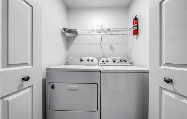a washer and dryer in a laundry room with a fire hydrant