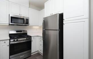 a kitchen with a stove top oven sitting inside of a refrigerator