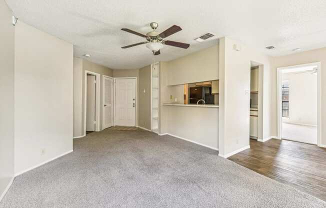 Open concept living room with high ceilings at Bandera Crossing apartments in San Antonio, TX