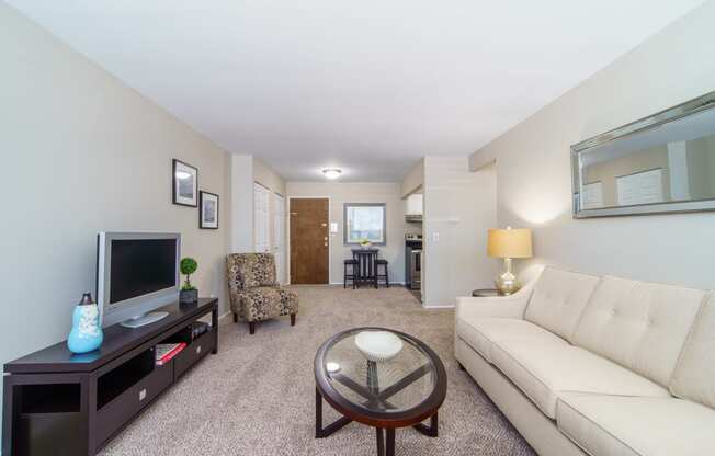 Living area with plush beige carpeting.