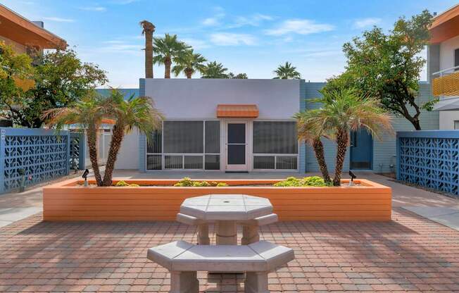 A building with a sign that reads at The Phoenix Apartments on 6th Avenue, Phoenix