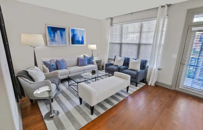 a living room with hardwood floors and a sliding glass door