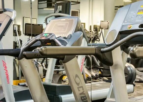 a row of weights machines in a gym