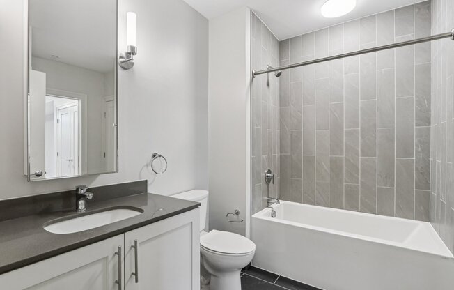 Bathroom with bathtub and toilet at Park77 Apartments, Massachusetts, 02138