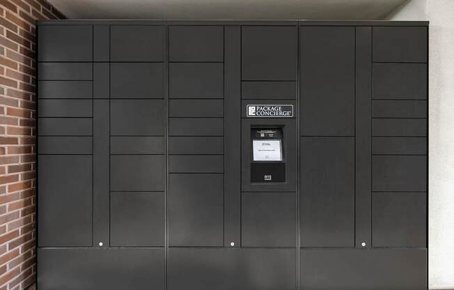 A black door with a sign that says "Penrose Concourse".