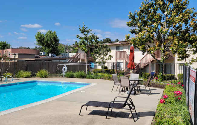 Crystal clear swimming pool and sun deck at Plaza Verde Apartments in Escondido, California.