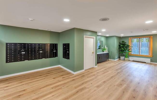 Large room with mail slots on the wall.