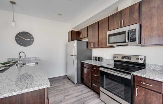 Kitchen With Granite Countertops & Stainless Steel Appliances