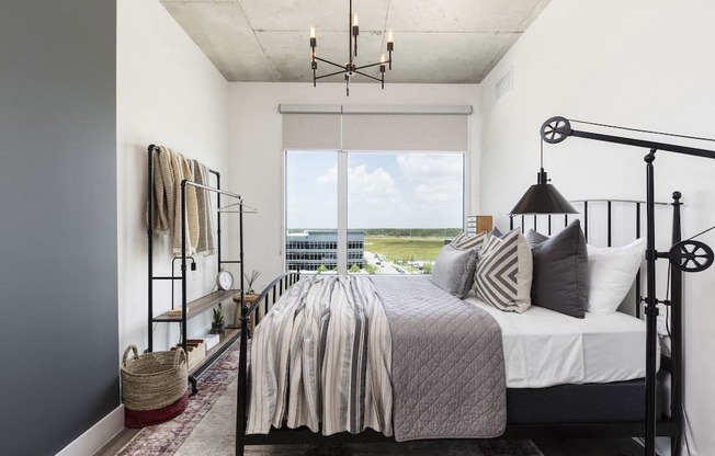 bedroom with large window and high ceiling at Lake Nona Pixon, Orlando, Florida