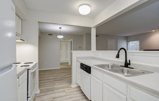 Modern matte black sprayer faucet at Rainbow Ridge Apartments in Kansas City, Kansas