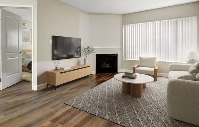 A modern living room with a fireplace and a television.