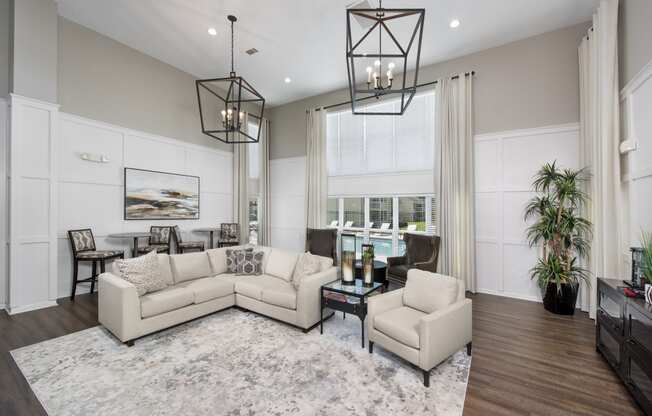 a living room with couches and chairs and a table
