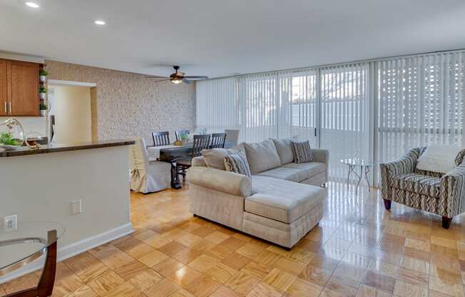 a living room and dining room with a couch and a table