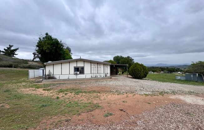 2 bedroom 2 bathroom ranch style single story home for LEASE with horse stables on site!
