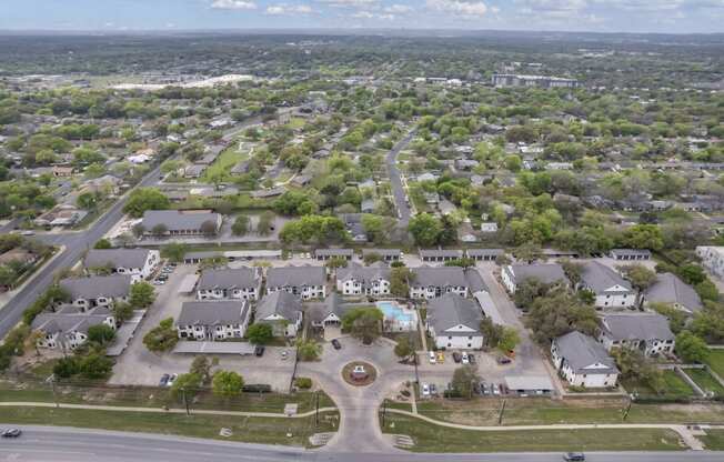 an aerial view of a neighborhood of houses and trees