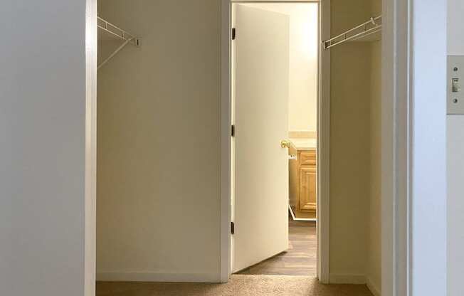 closet area with doorway to bathroom