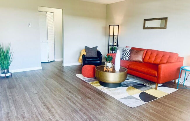 a living room with a couch and a table in it at Element LLC, Sunnyvale