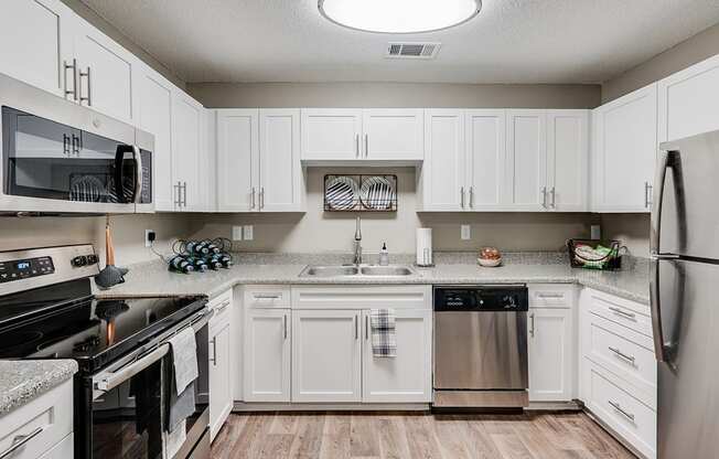 White Cabinetry with Stainless Steel Appliances