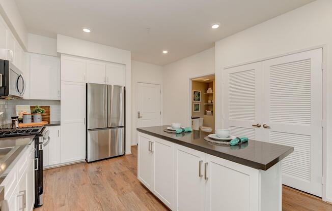 a kitchen with a sink and a refrigerator